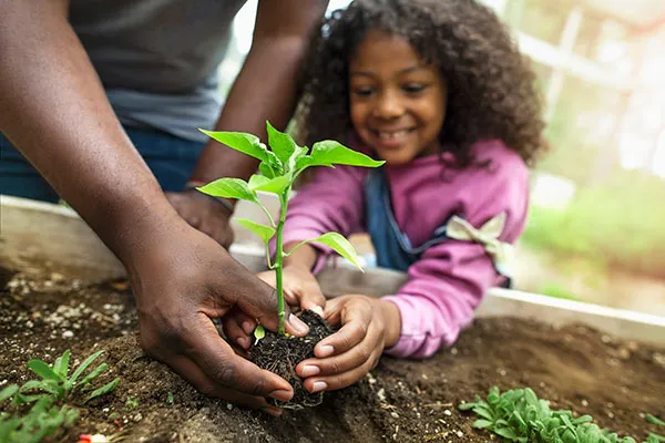 girl-planting-garden